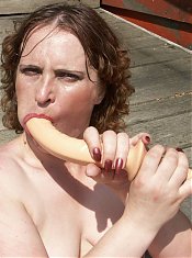Hot mature redhead takes her clothes off to masturbate with a dildo during a live cam show